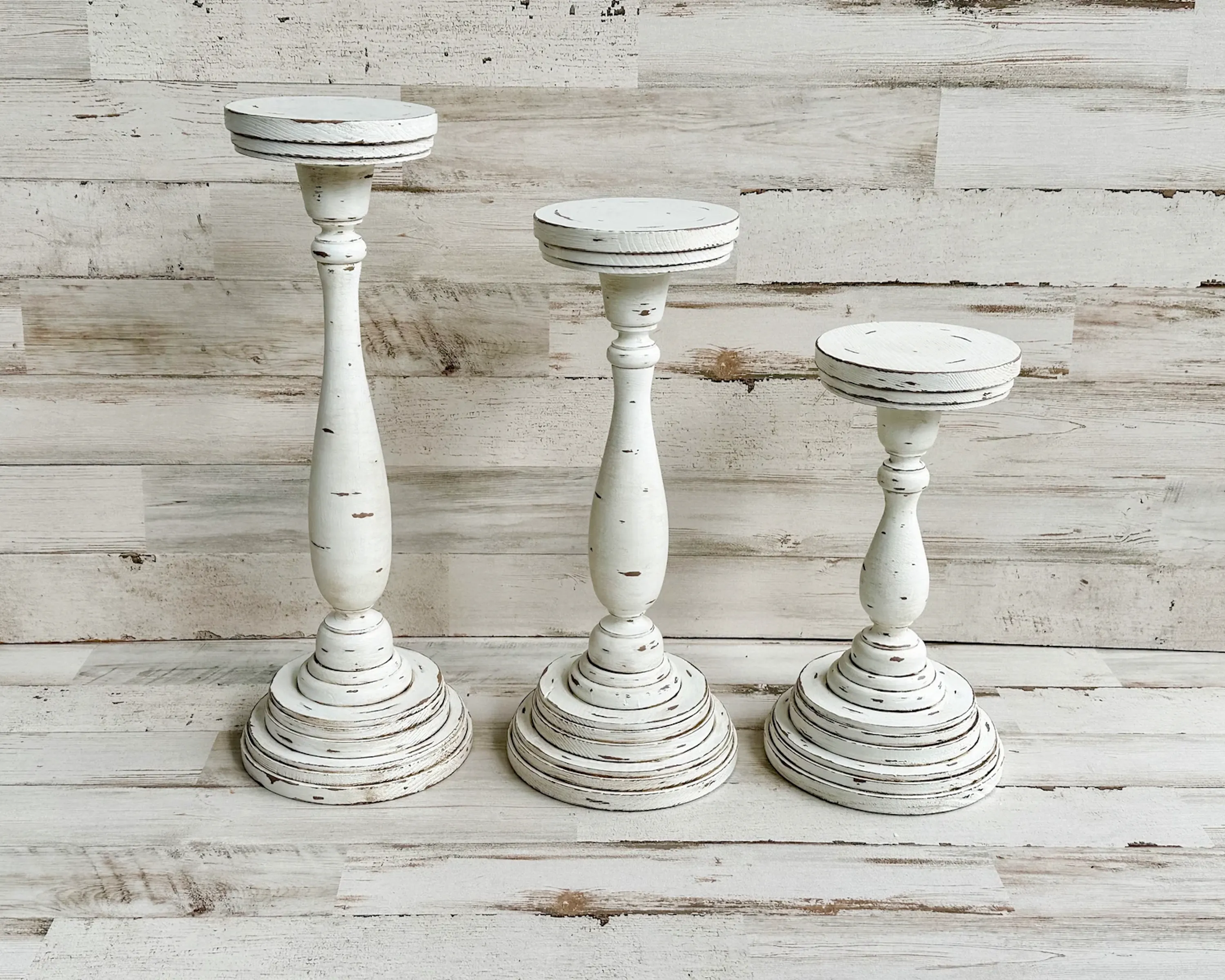 Rustic distressed wooden pillar candle holder set