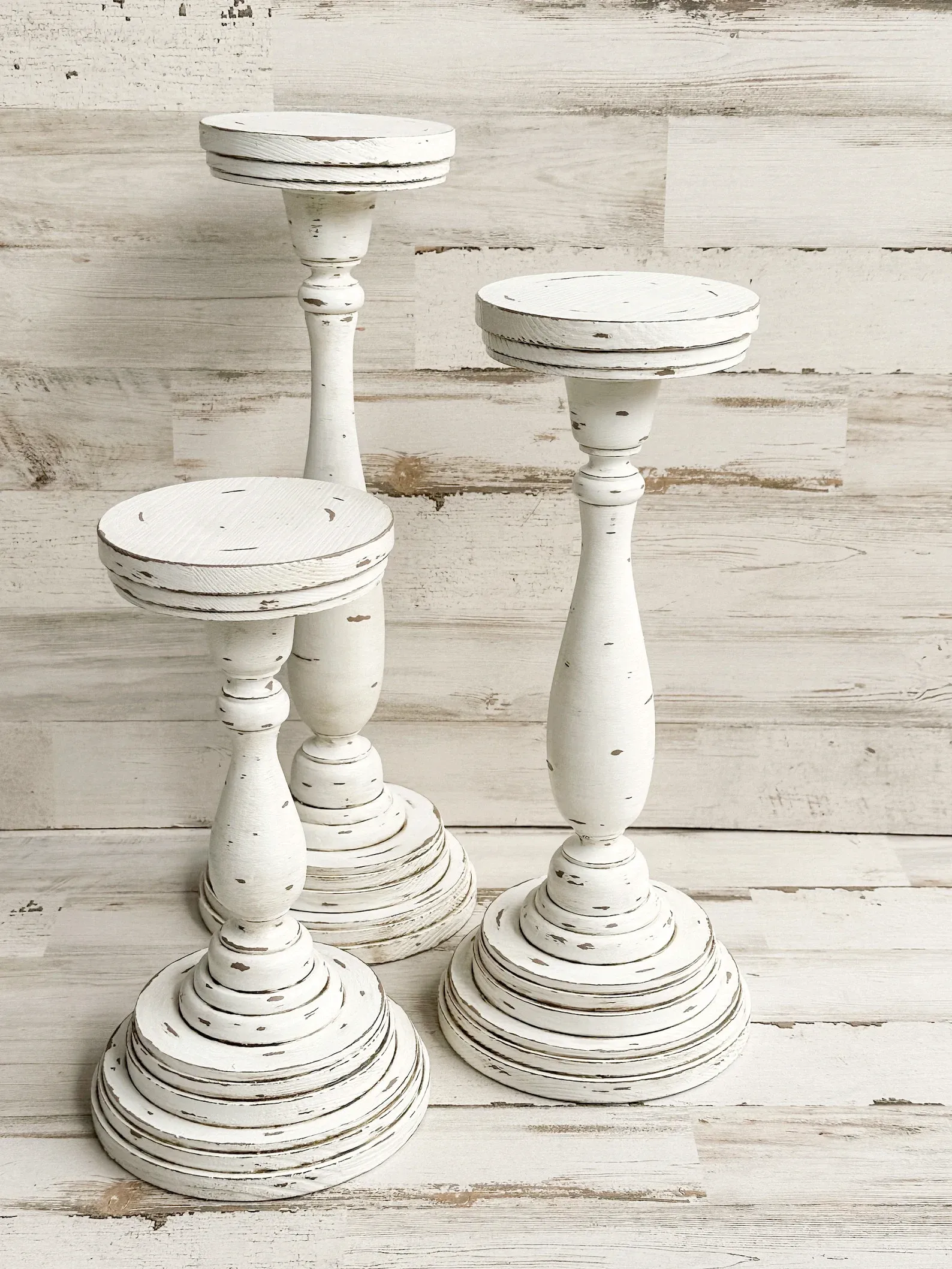 Rustic distressed wooden pillar candle holder set
